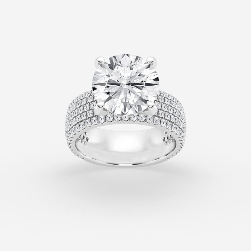 Round halo engagement ring in white gold with pavé band